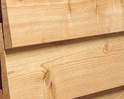 A closeup of western red cedar bevel siding